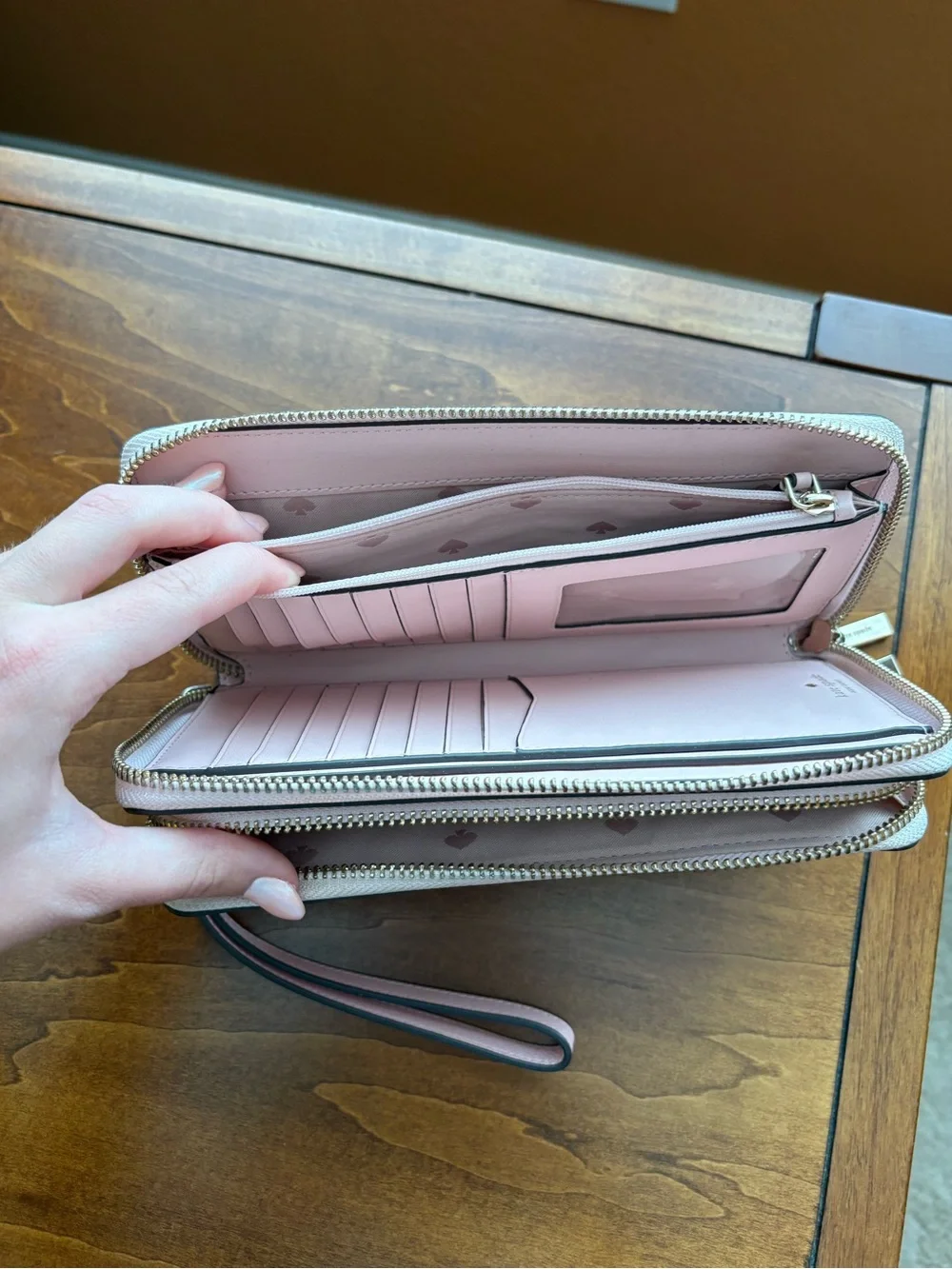 kate spade light pink zip-around wristlet wallet